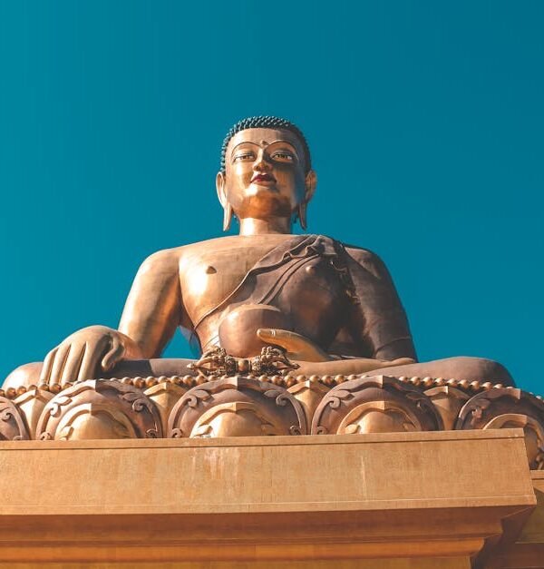 Stunning view of the Buddha Dordenma statue under a clear blue sky in Bhutan.